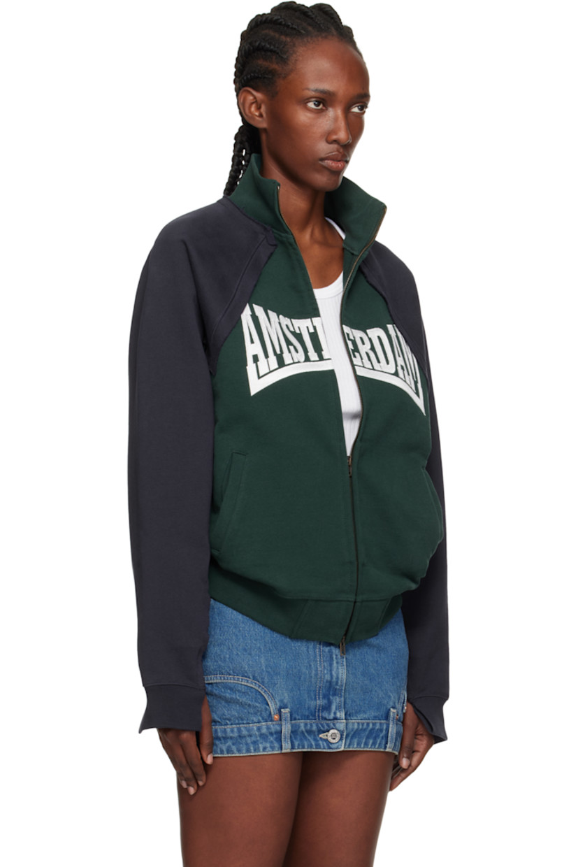 French terry sweatshirt.

· Raw edges throughout
· Paneled construction
· Stand collar
· Two-way zip closure
· Embroidered text and welt pockets at front
· Rib-knit hem and cuffs
· Raglan sleeves
· Logo embroidered at back collar

Supplier color: Emerald green/Navy
