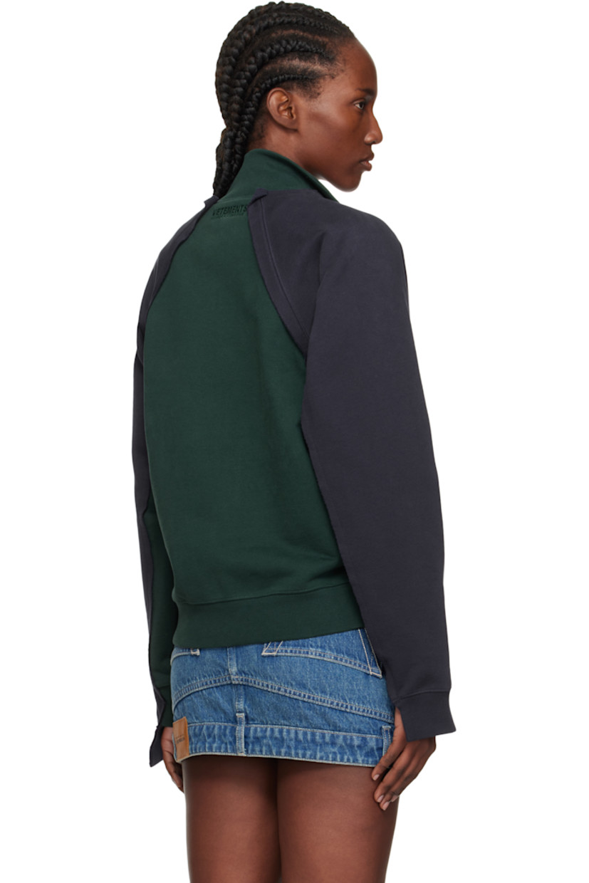 French terry sweatshirt.

· Raw edges throughout
· Paneled construction
· Stand collar
· Two-way zip closure
· Embroidered text and welt pockets at front
· Rib-knit hem and cuffs
· Raglan sleeves
· Logo embroidered at back collar

Supplier color: Emerald green/Navy