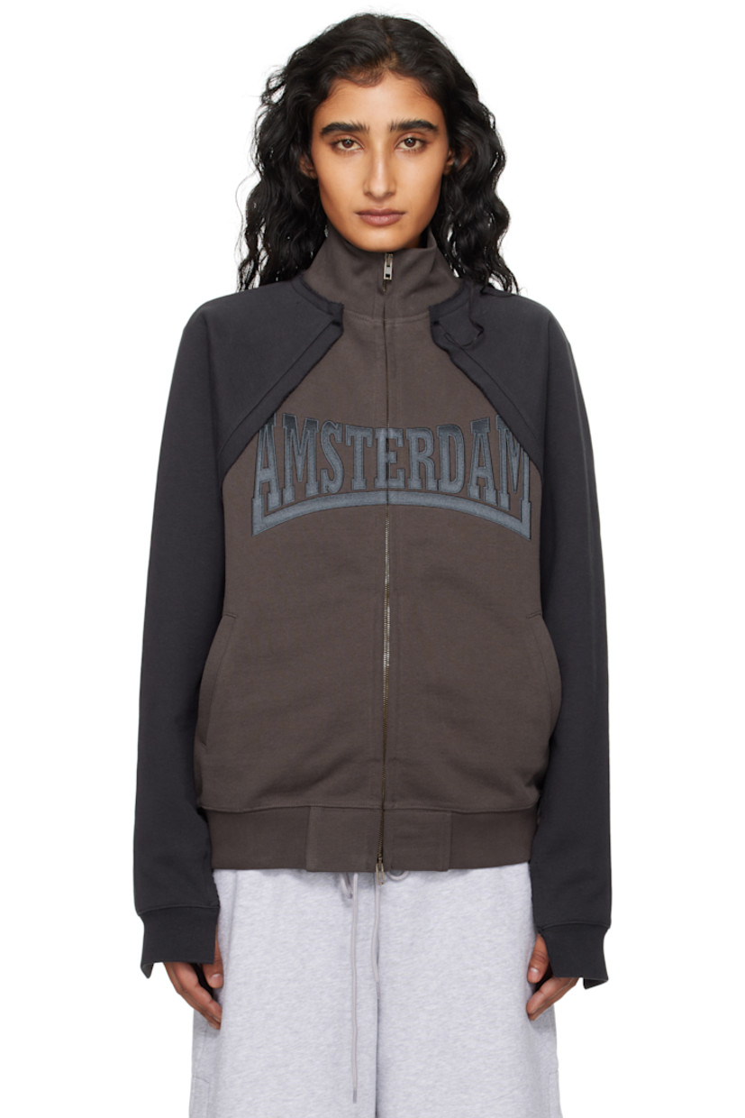 Cotton-blend French terry jacket. 

· Paneled construction 
· Raw edge throughout 
· Rib-knit stand collar, hem, and cuffs
· Two-way zip closure 
· Embroidered text at front 
· Welt pockets at waist
· Raglan sleeves
· Logo embroidered at back collar 

Supplier color: Chocolate brown