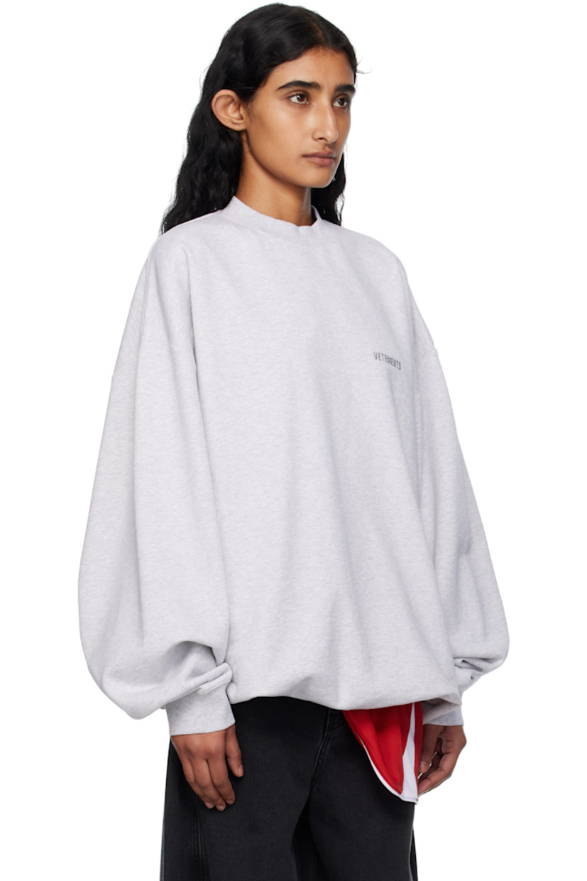 French terry sweatshirt.

· Rib-knit crewneck, hem, and cuffs
· Logo embroidered at chest and back collar
· Dropped shoulders

Supplier color: Grey melange