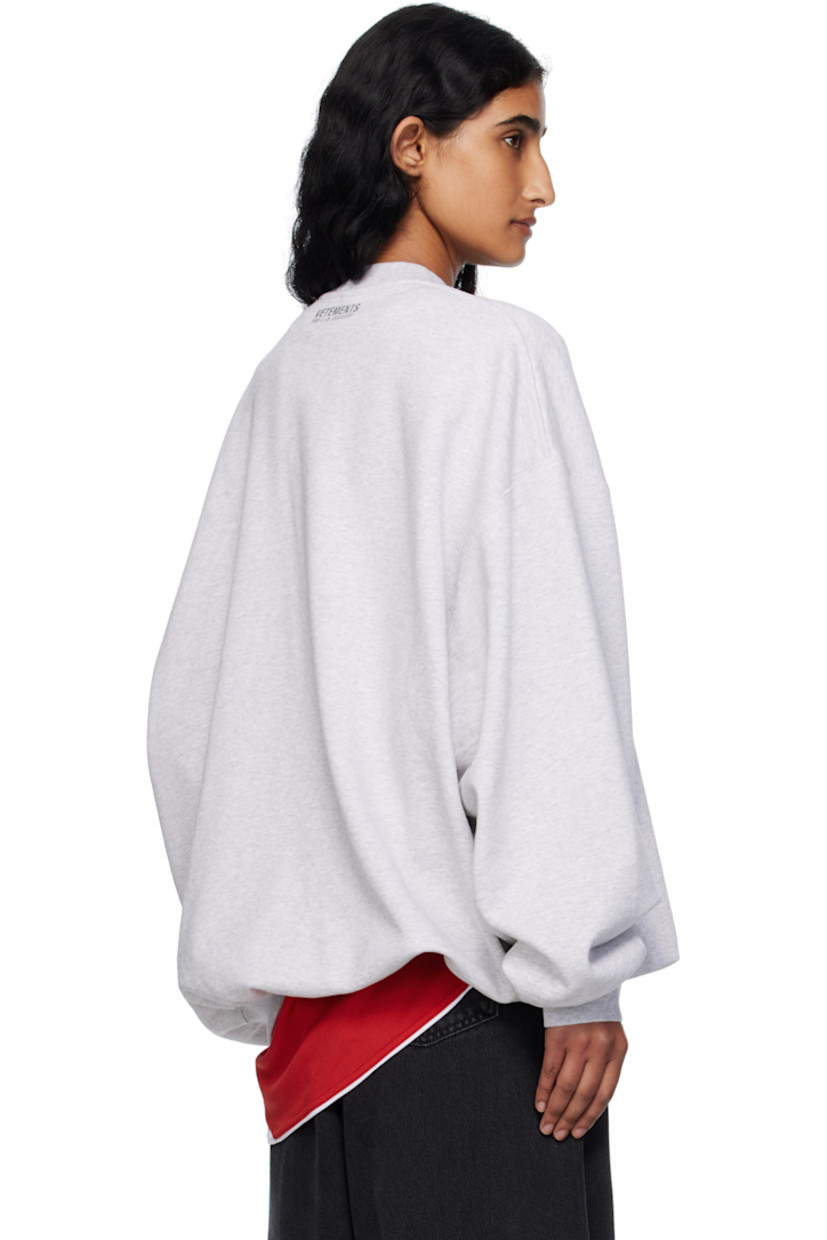 French terry sweatshirt.

· Rib-knit crewneck, hem, and cuffs
· Logo embroidered at chest and back collar
· Dropped shoulders

Supplier color: Grey melange