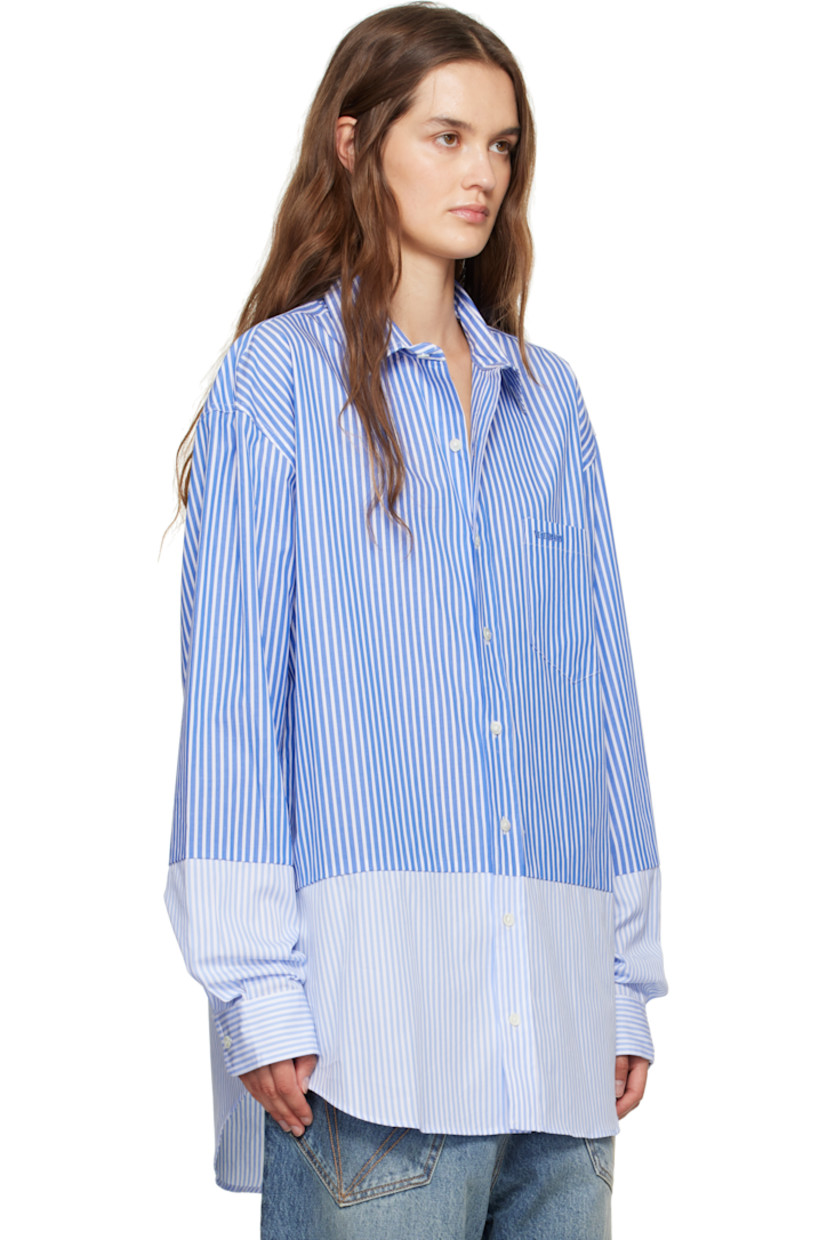 Cotton poplin shirt.

· Stripes throughout
· Paneled construction
· Spread collar
· Button closure
· Logo-embroidered patch pocket at chest
· Shirttail hem
· Buttoned barrel cuffs
· Pleats at back yoke

Supplier color: Light blue pinstripe