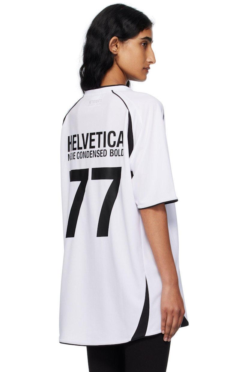 Mesh jersey.

· Paneled construction
· V-neck
· Text printed and embroidered at front and back
· Graphic embroidered at chest
· Raglan sleeves
· Logo embroidered at back 

Supplier color: White