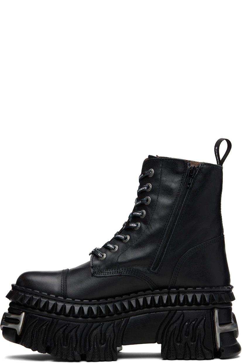 Ankle-high buffed leather boots.

· Logo-engraved hardware at toe and heel
· Logo hardware at cord-lock lace-up closure
· Logo-printed pull-loop at heel collar
· Logo embossed at outer side
· Zip closure at inner side
· Sculptural rubber platform midsole
· Treaded rubber sole
· Platform: H3.5"

Part of the VETEMENTS x New Rock collaboration.

Supplier color: Black leather
