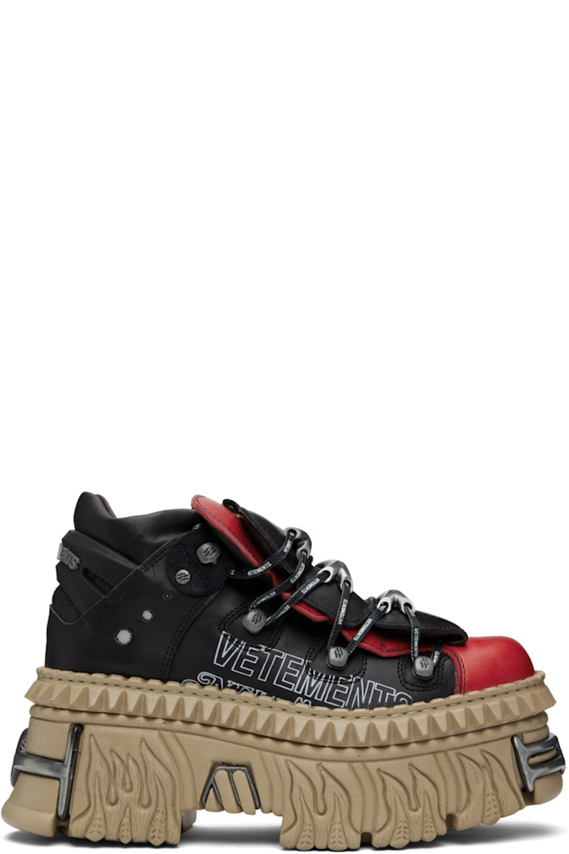 Low-top buffed leather sneakers.

· Logo-engraved hardware at toe and heel
· Logo plaques at lace-up closure
· Layered padded tongue
· Padded collar
· Mesh eyelets at sides
· Logo printed at outer side
· Rubberized logo-embossed pull-loop at heel
· Sculptural rubber platform midsole
· Treaded rubber sole
· Platform: H3.5"

Part of the VETEMENTS x New Rock collaboration.

Supplier color: Black/Logo print