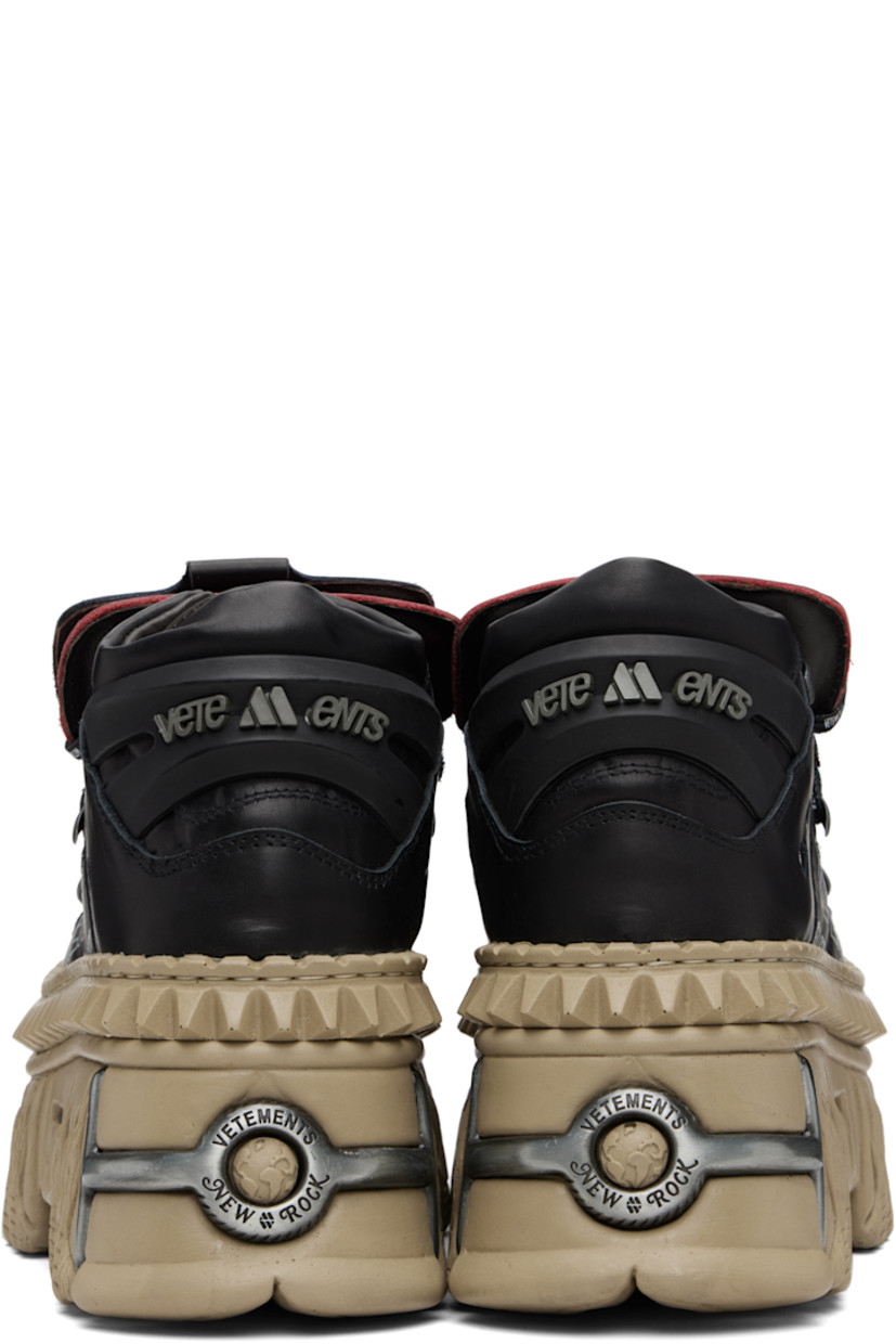 Low-top buffed leather sneakers.

· Logo-engraved hardware at toe and heel
· Logo plaques at lace-up closure
· Layered padded tongue
· Padded collar
· Mesh eyelets at sides
· Logo printed at outer side
· Rubberized logo-embossed pull-loop at heel
· Sculptural rubber platform midsole
· Treaded rubber sole
· Platform: H3.5"

Part of the VETEMENTS x New Rock collaboration.

Supplier color: Black/Logo print