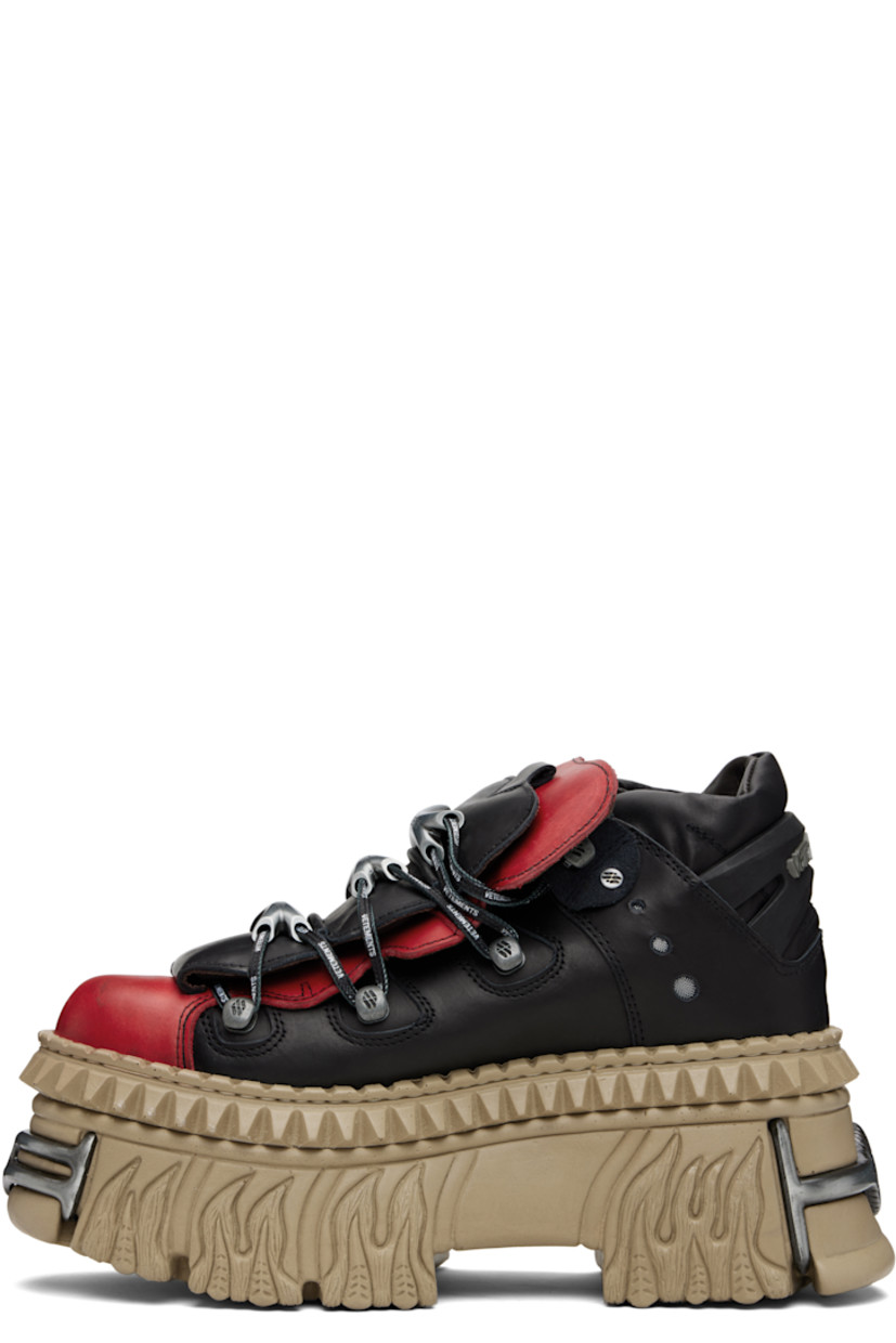 Low-top buffed leather sneakers.

· Logo-engraved hardware at toe and heel
· Logo plaques at lace-up closure
· Layered padded tongue
· Padded collar
· Mesh eyelets at sides
· Logo printed at outer side
· Rubberized logo-embossed pull-loop at heel
· Sculptural rubber platform midsole
· Treaded rubber sole
· Platform: H3.5"

Part of the VETEMENTS x New Rock collaboration.

Supplier color: Black/Logo print