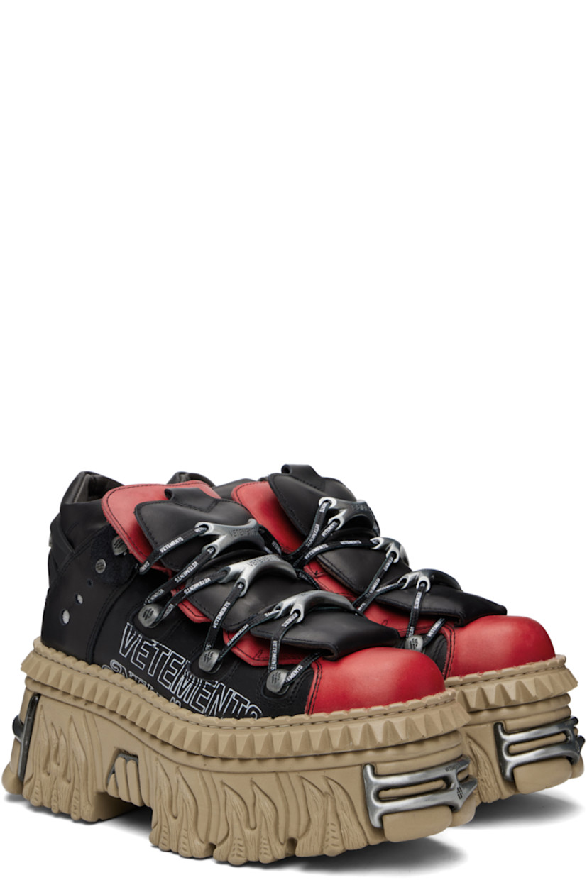 Low-top buffed leather sneakers.

· Logo-engraved hardware at toe and heel
· Logo plaques at lace-up closure
· Layered padded tongue
· Padded collar
· Mesh eyelets at sides
· Logo printed at outer side
· Rubberized logo-embossed pull-loop at heel
· Sculptural rubber platform midsole
· Treaded rubber sole
· Platform: H3.5"

Part of the VETEMENTS x New Rock collaboration.

Supplier color: Black/Logo print