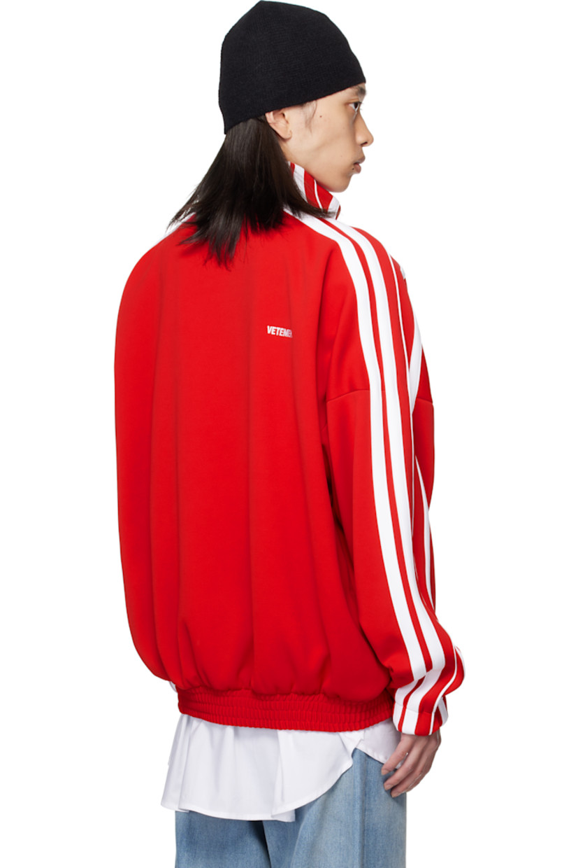 Jersey track jacket.

· Stand collar
· Two-way zip closure
· Logo embroidered at chest and back collar
· Zip pockets at front
· Elasticized hem and cuffs
· Dropped shoulders
· Stripe appliqués at sleeves
· Full mesh lining

Supplier color: Red
