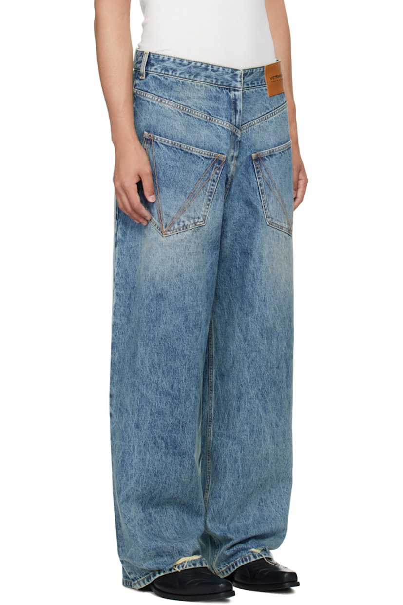 Non-stretch denim jeans.

· Backwards construction
· Fading throughout
· Belt loops
· Six-pocket styling
· Concealed zip fly
· Leather logo patch at front waist
· Distressing at front cuffs
· Copper-tone hardware
· Contrast stitching in tan

Supplier color: Distressed blue