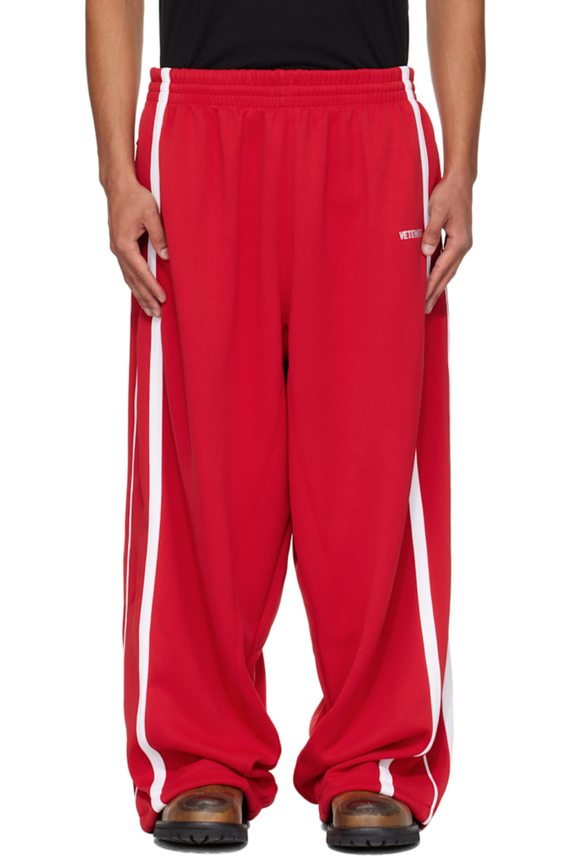 Jersey sweatpants.

· Concealed drawstring at elasticized waistband
· Three-pocket styling
· Logo embroidered at front
· Bungee-style drawstring at cuffs
· Stripes at outseams
· Full mesh lining

Supplier color: Red