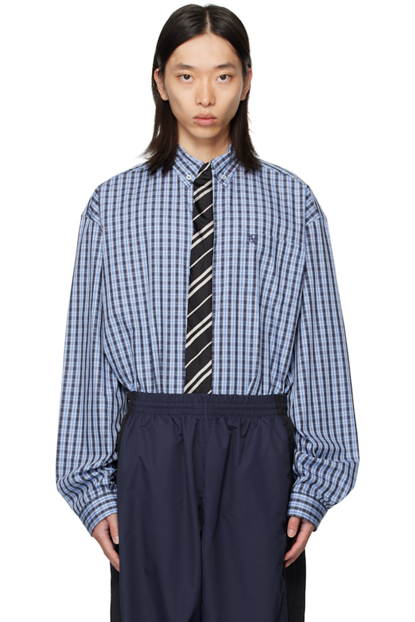 Cotton poplin shirt.

· Check pattern throughout
· Spread collar
· Silk satin tie appliqué at concealed button closure
· Logo-embroidered patch pocket at chest
· Shirttail hem
· Buttoned barrel cuffs
· Box pleat at back yoke

Supplier color: Blue check