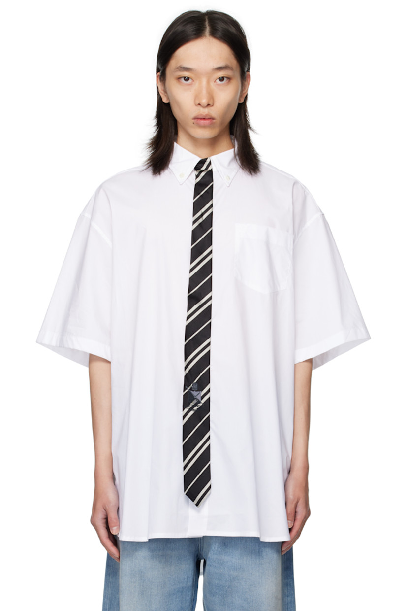 Cotton poplin shirt.

· Spread collar
· Silk satin tie appliqué at concealed button closure
· Logo-embroidered patch pocket at chest
· Shirttail hem
· Box pleat at back yoke

Supplier color: White/Black