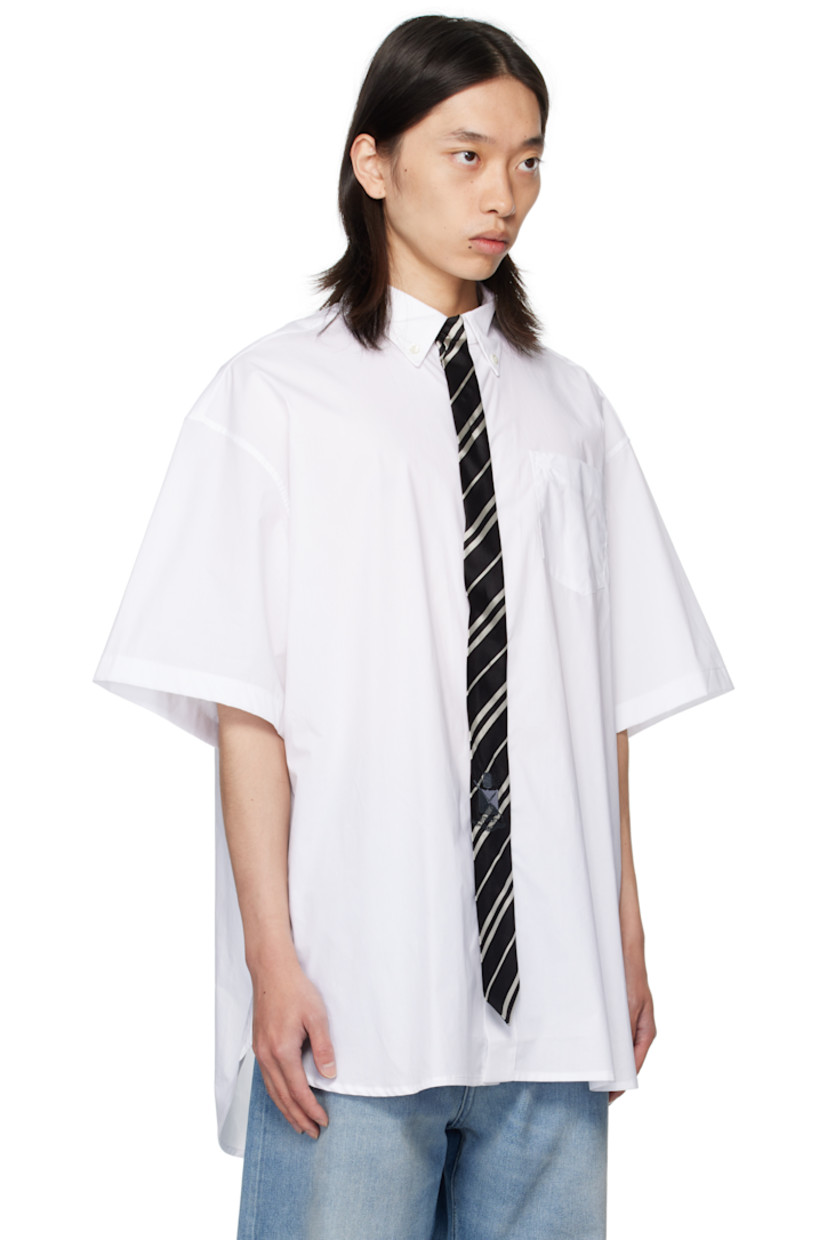 Cotton poplin shirt.

· Spread collar
· Silk satin tie appliqué at concealed button closure
· Logo-embroidered patch pocket at chest
· Shirttail hem
· Box pleat at back yoke

Supplier color: White/Black