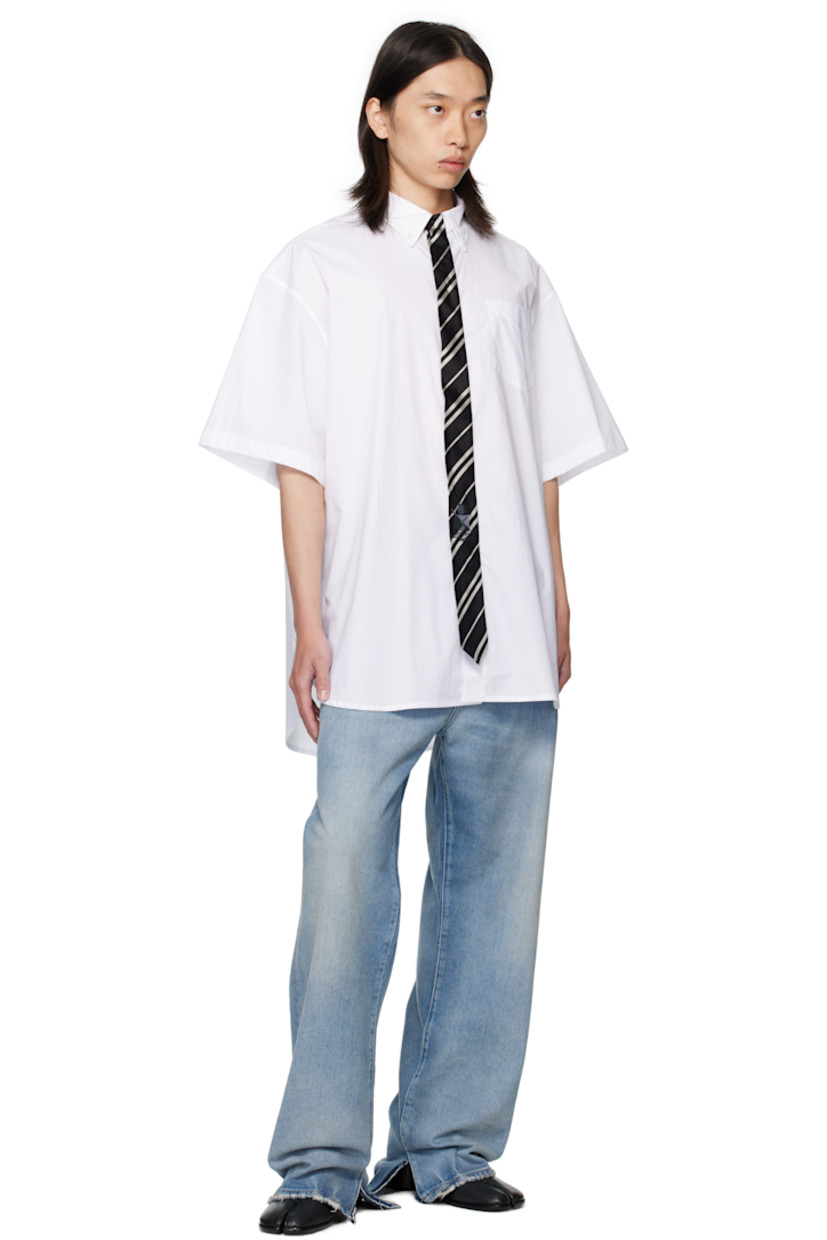 Cotton poplin shirt.

· Spread collar
· Silk satin tie appliqué at concealed button closure
· Logo-embroidered patch pocket at chest
· Shirttail hem
· Box pleat at back yoke

Supplier color: White/Black