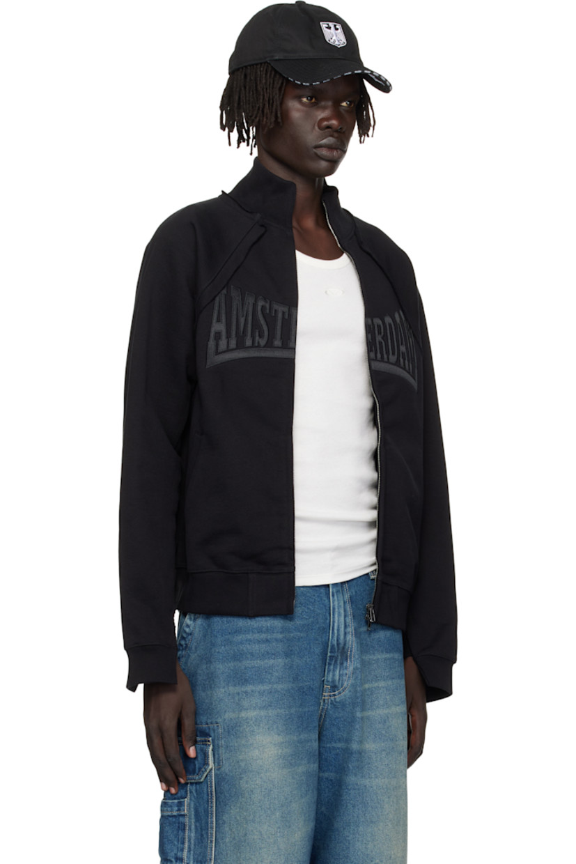 Cotton-blend French terry sweatshirt.

· Raw edges throughout
· Paneled construction
· Stand collar
· Two-way zip closure
· Embroidered text at chest
· Welt pockets at waist
· Rib-knit hem and cuffs
· Raglan sleeves
· Logo embroidered at back collar

Supplier color: Black