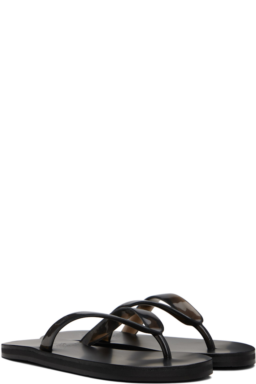 Handcrafted vinyl flip-flops.

· Logo-embossed thong-style strap
· Vegetable-tanned buffed leather footbed
· Hand-stitched stacked leather midsole
· Logo-embossed rubber sole

Supplier color: Black