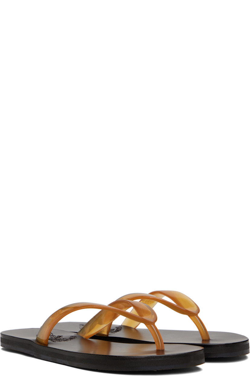 Handcrafted semi-transparent vinyl flip-flops.

· Logo-embossed thong-style strap
· Vegetable-tanned buffed leather footbed
· Hand-stitched stacked leather midsole
· Logo-embossed rubber sole

Supplier color: Clear caramel