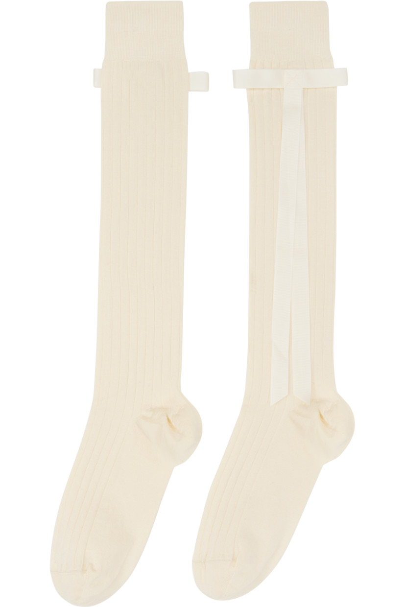 Pair of knee-high rib-knit stretch cotton-blend socks in off-white. Bow appliqué at cuffs.

Part of the exclusive SSENSE Bridal capsule.

Supplier color: Tofu