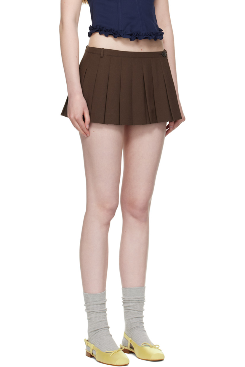 Pleated polyester broadcloth skort.

· Low-rise
· Belt loops
· Zip fly
· Vented side seam with button fastening
· Viscose satin lining

Supplier color: Dark brown
