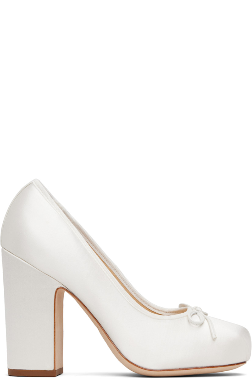 Silk-blend satin heels.

· Square toe 
· Bow accent at vamp
· Grosgrain trim at collar 
· Logo patch at padded footbed
· Covered block heel with rubber injection 
· Suede sole 
· Heel: H4"

Supplier color: Pearl satin