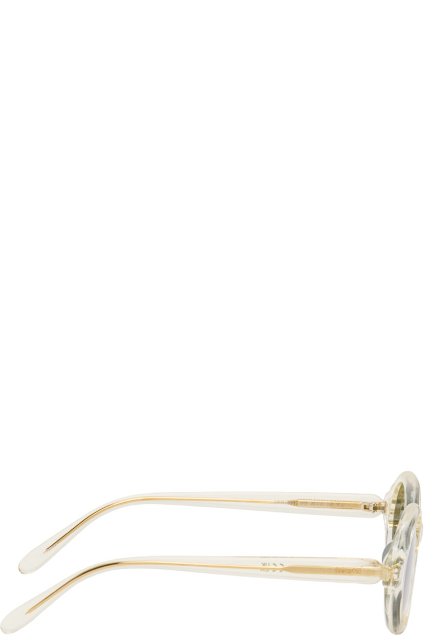Oval transparent acetate-frame sunglasses.

· Green lenses 
· 100% UVA/UVB protection, category 3
· Integrated nose pads
· Inset logo at temples
· Exposed core wires
· Gold-tone hardware
· Includes pouch
· Size: 48.21 140

Supplier color: Champagne