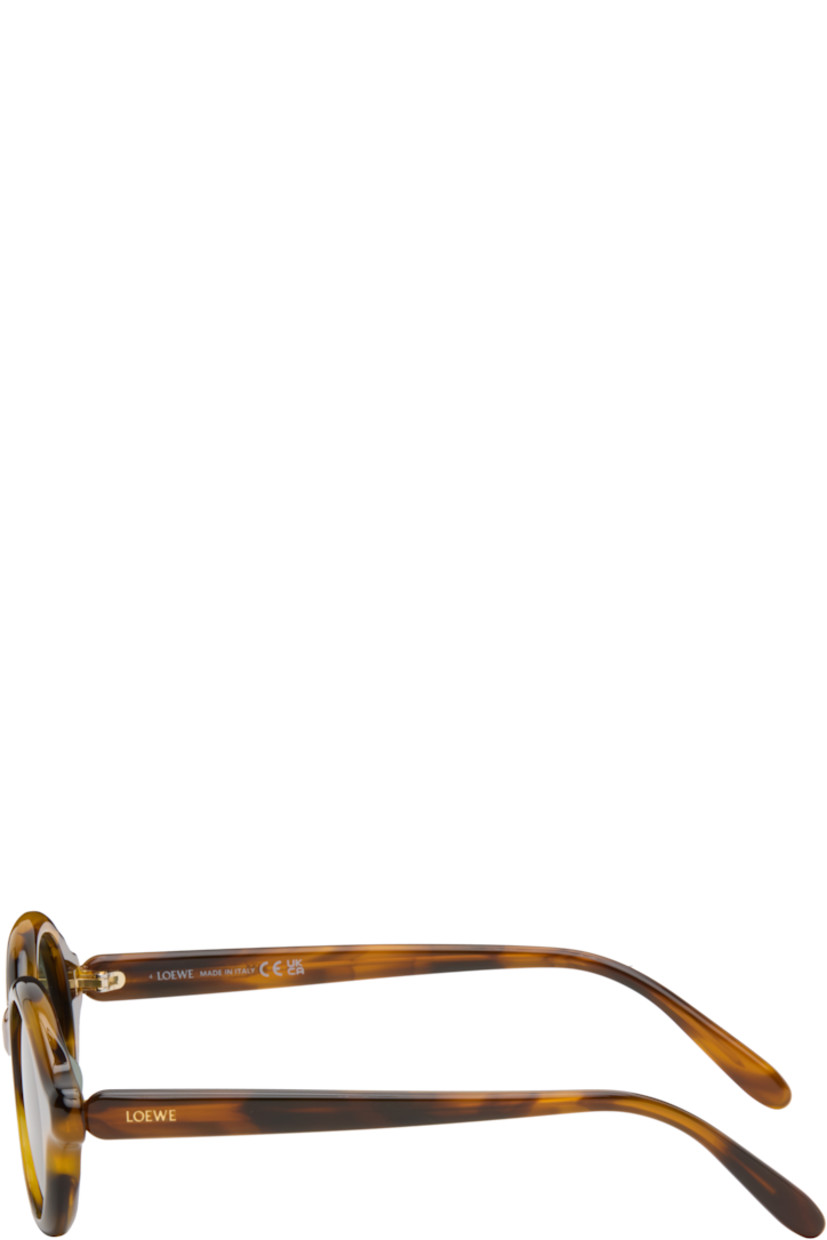 Oval tortoiseshell acetate-frame sunglasses.

· Green lenses 
· 100% UVA/UVB protection, category 3
· Integrated nose pads
· Inset logo at temples
· Exposed core wires
· Gold-tone hardware
· Includes pouch
· Size: 48.21 140

Supplier color: Havana special