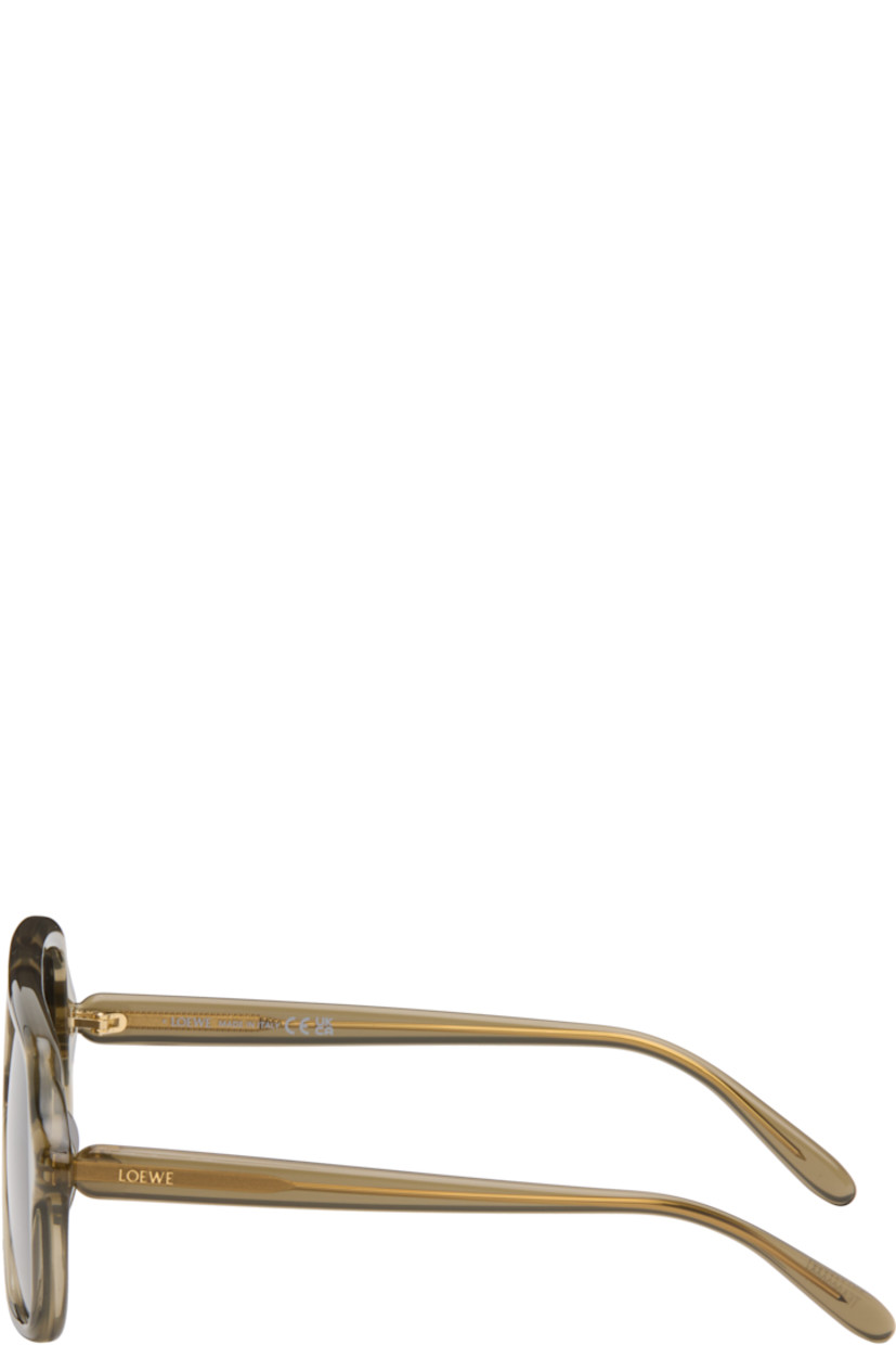 Aviator-style semi-transparent acetate-frame sunglasses.

· Gray lenses
· 100% UVA/UVB protection, category 3
· Double bridge 
· Integrated nose pads
· Inset logo at temples
· Exposed core wires
· Gold-tone hardware
· Includes pouch
· Size: 54.16 140

Supplier color: Khaki green