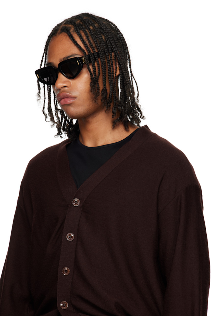 Cat-eye acetate-frame sunglasses. 

· Gray lenses
· 100% UVA/UVB protection, category 3
· Integrated nose pads
· Studs at face
· Logo hardware at temples
· Gold-tone hardware
· Includes pouch
· Size: 51.19 145

Supplier color: Black