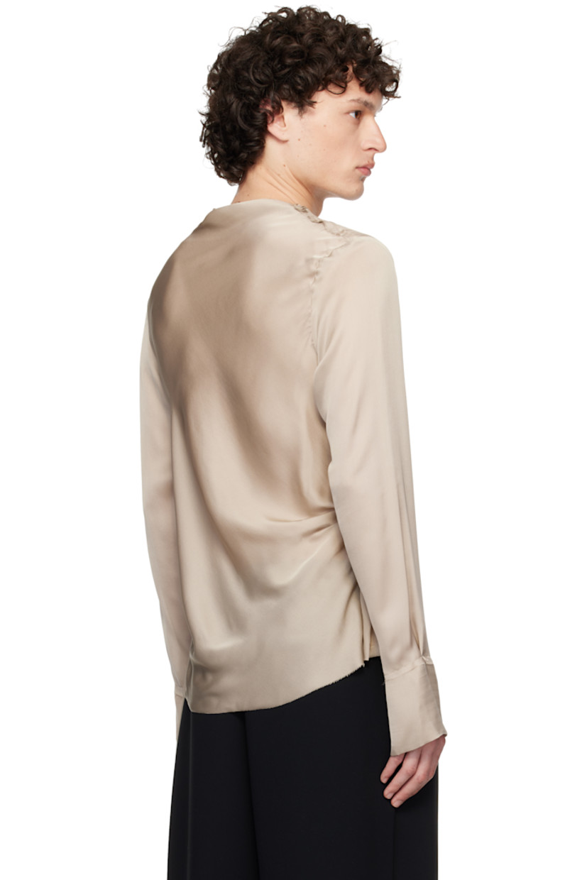Semi-sheer silk satin blouse. Frayed edges throughout. 

· Draped boatneck 
· Extended draped panel at side seam 
· Vent at cuffs

Supplier color: Taupe