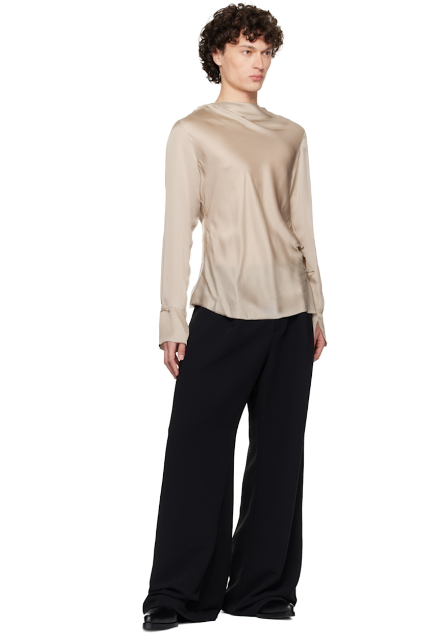 Semi-sheer silk satin blouse. Frayed edges throughout. 

· Draped boatneck 
· Extended draped panel at side seam 
· Vent at cuffs

Supplier color: Taupe
