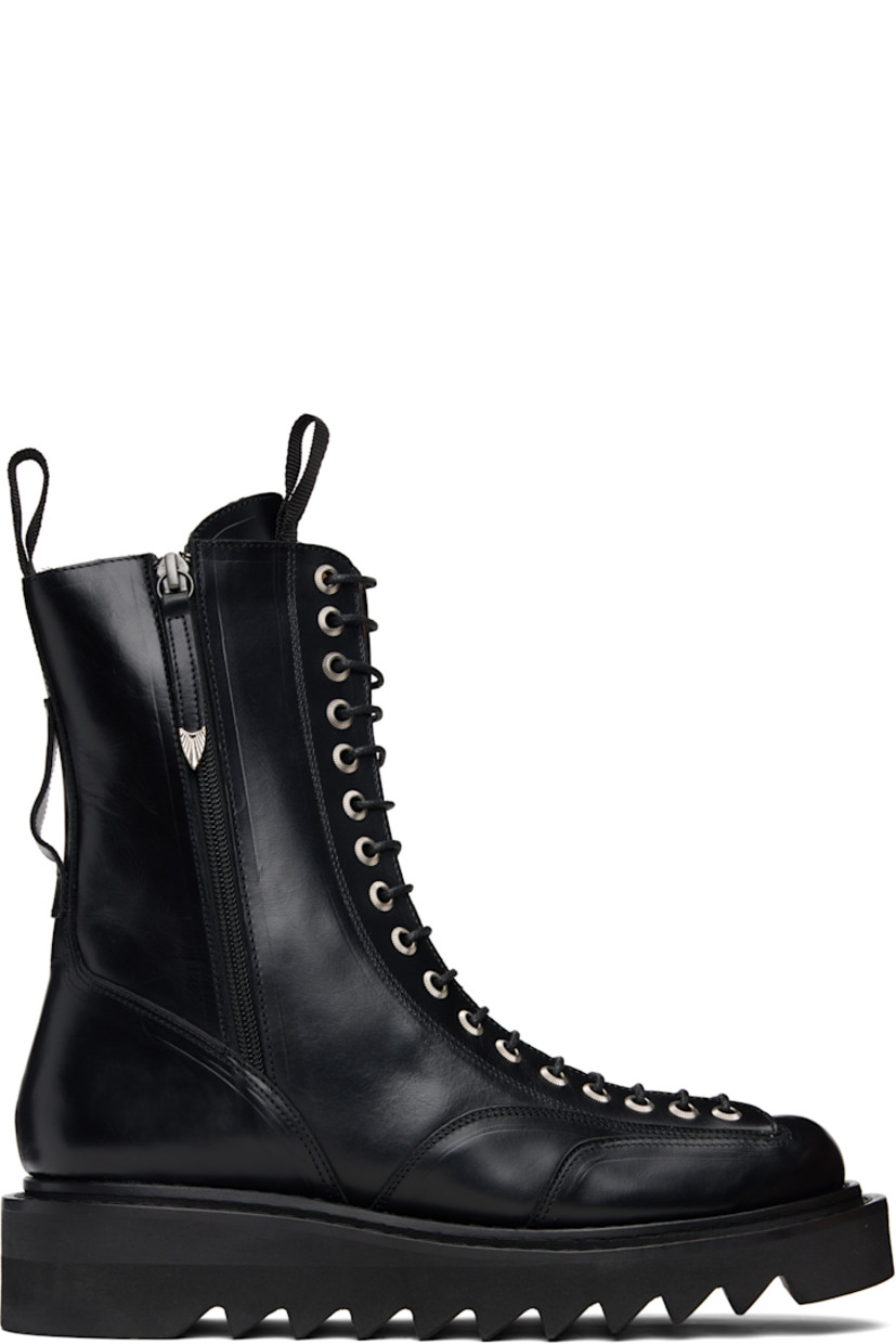 Mid-calf buffed leather boots.

· Lace-up closure
· Pull-loop at tongue and heel collar
· Zip closure at sides
· Foam rubber midsole 
· Treaded rubber sole

Supplier color: Black