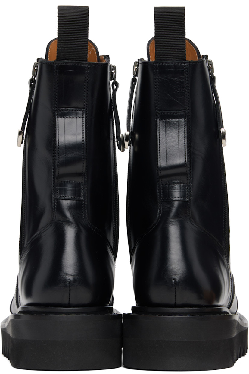 Mid-calf buffed leather boots.

· Lace-up closure
· Pull-loop at tongue and heel collar
· Zip closure at sides
· Foam rubber midsole 
· Treaded rubber sole

Supplier color: Black