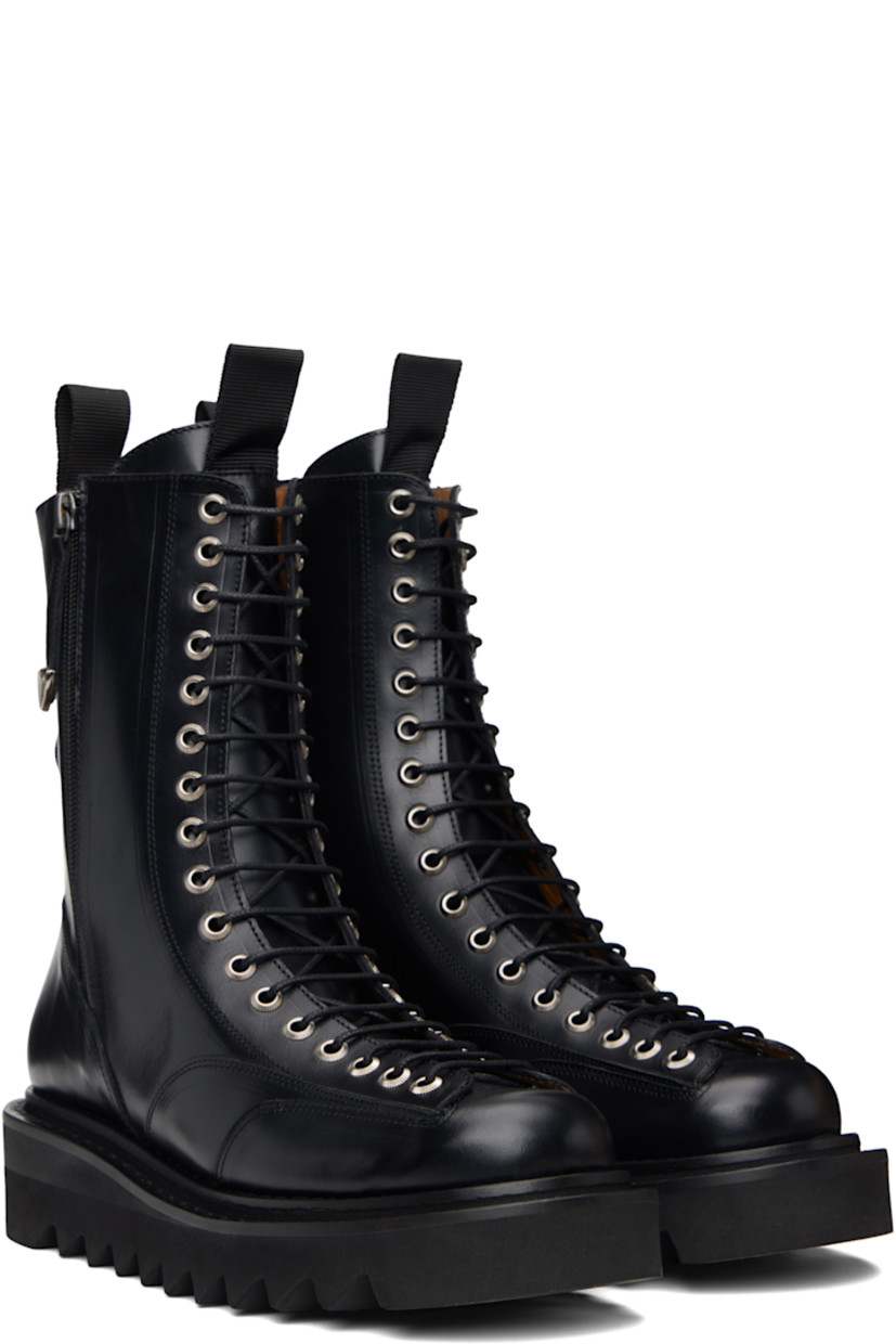 Mid-calf buffed leather boots.

· Lace-up closure
· Pull-loop at tongue and heel collar
· Zip closure at sides
· Foam rubber midsole 
· Treaded rubber sole

Supplier color: Black