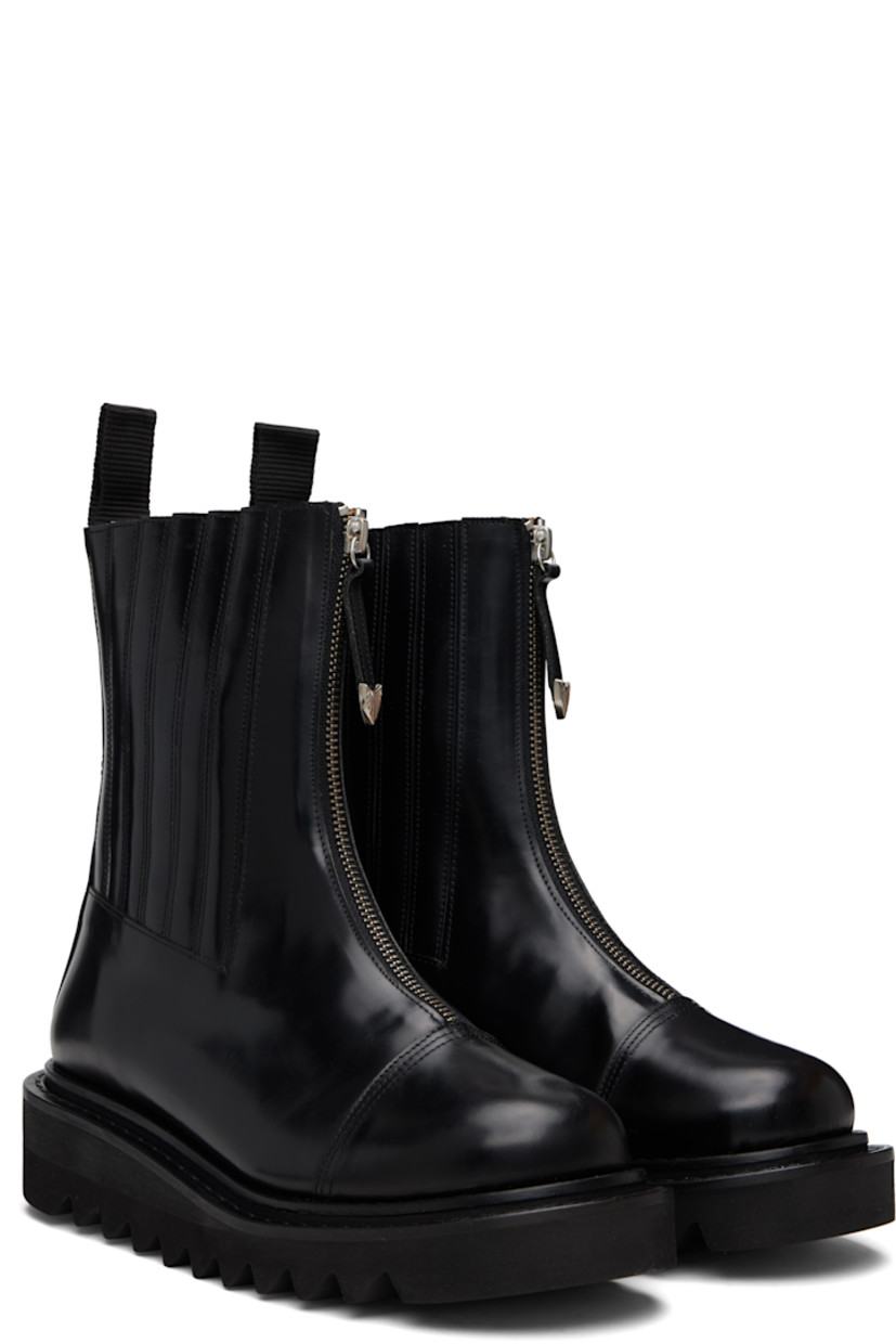 Calf-high buffed leather boots.

· Zip closure
· Leather-covered elasticized gussets
· Pull-loop at collar
· Engraved hardware at heel counter
· Leather lining
· Treaded foam rubber platform sole
· Platform: H1.75"

Supplier color: Black