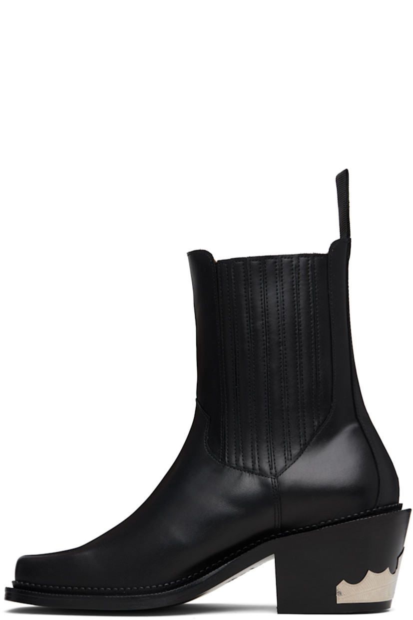Ankle-high buffed leather boots.

· Square toe
· Leather-covered elasticized gussets
· Pull-loop at heel collar
· Leather lining
· Stacked leather heel
· Treaded rubber sole
· Heel: H2.75"

Supplier color: Black