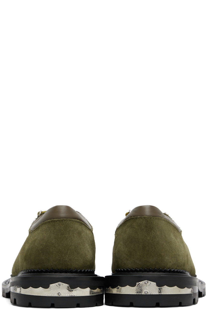 Suede derbys.

· Lace-up closure with engraved charms
· Padded leather collar
· Serrated edge at welt
· Etched plaque at heel 
· Treated rubber sole

Supplier color: Green