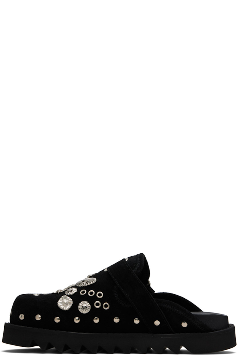 Suede slip-on loafers.

· Studs at toe and sides
· Graphic hardware and metal eyelets at vamp
· Pin-buckle strap at vamp
· Mesh lining
· Foam rubber midsole
· Treaded rubber sole

Available exclusively at SSENSE.

Supplier color: Black