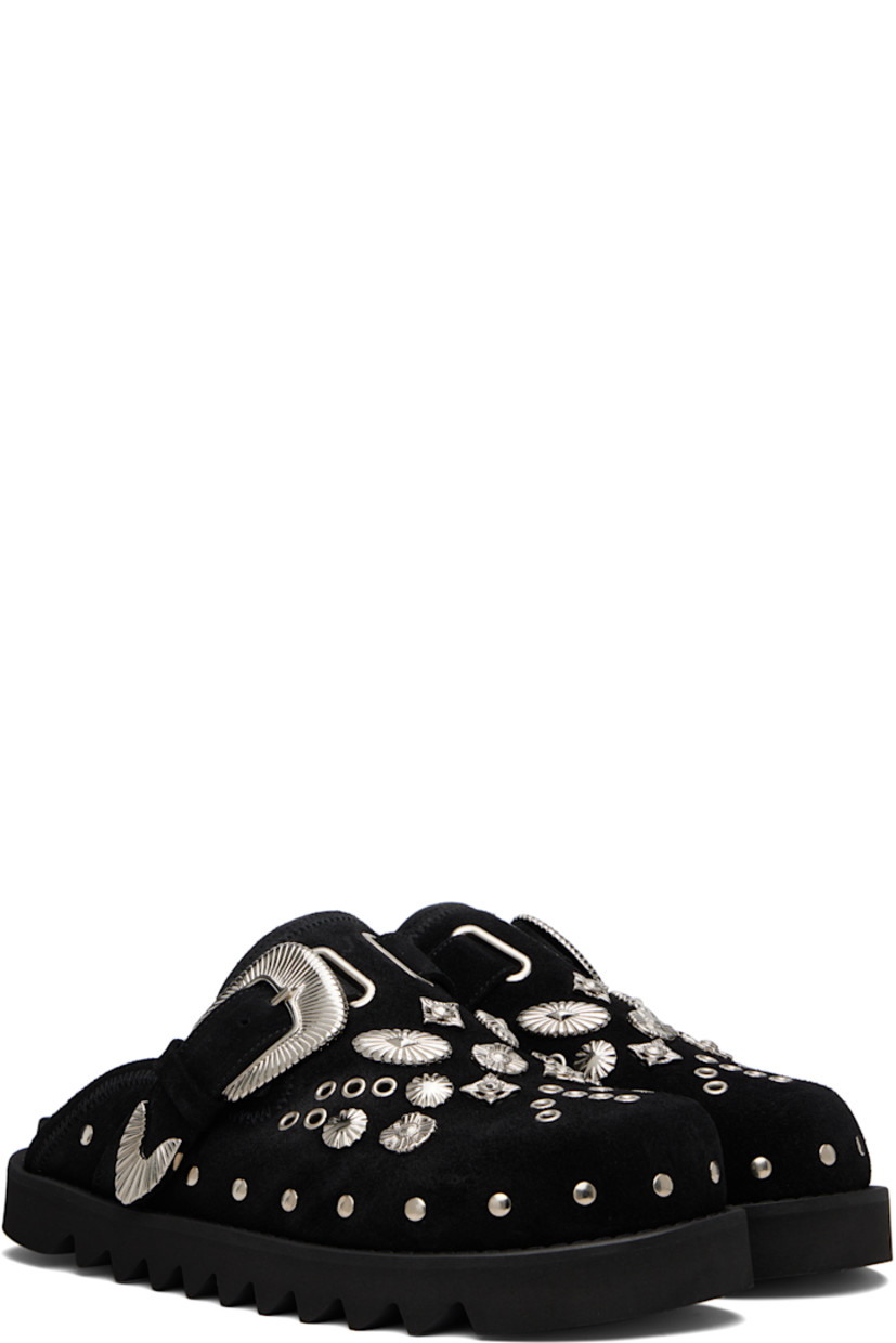 Suede slip-on loafers.

· Studs at toe and sides
· Graphic hardware and metal eyelets at vamp
· Pin-buckle strap at vamp
· Mesh lining
· Foam rubber midsole
· Treaded rubber sole

Available exclusively at SSENSE.

Supplier color: Black