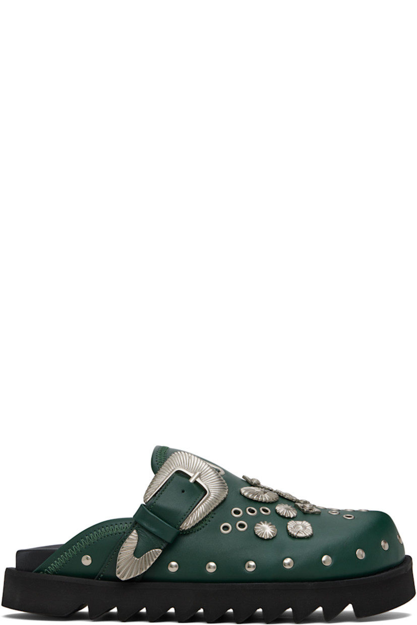 Buffed leather slip-on loafers.

· Studs at toe and sides
· Graphic hardware and metal eyelets at vamp
· Pin-buckle strap at vamp
· Mesh lining
· Foam rubber midsole
· Treaded rubber sole

Available exclusively at SSENSE.

Supplier color: Dark green leather