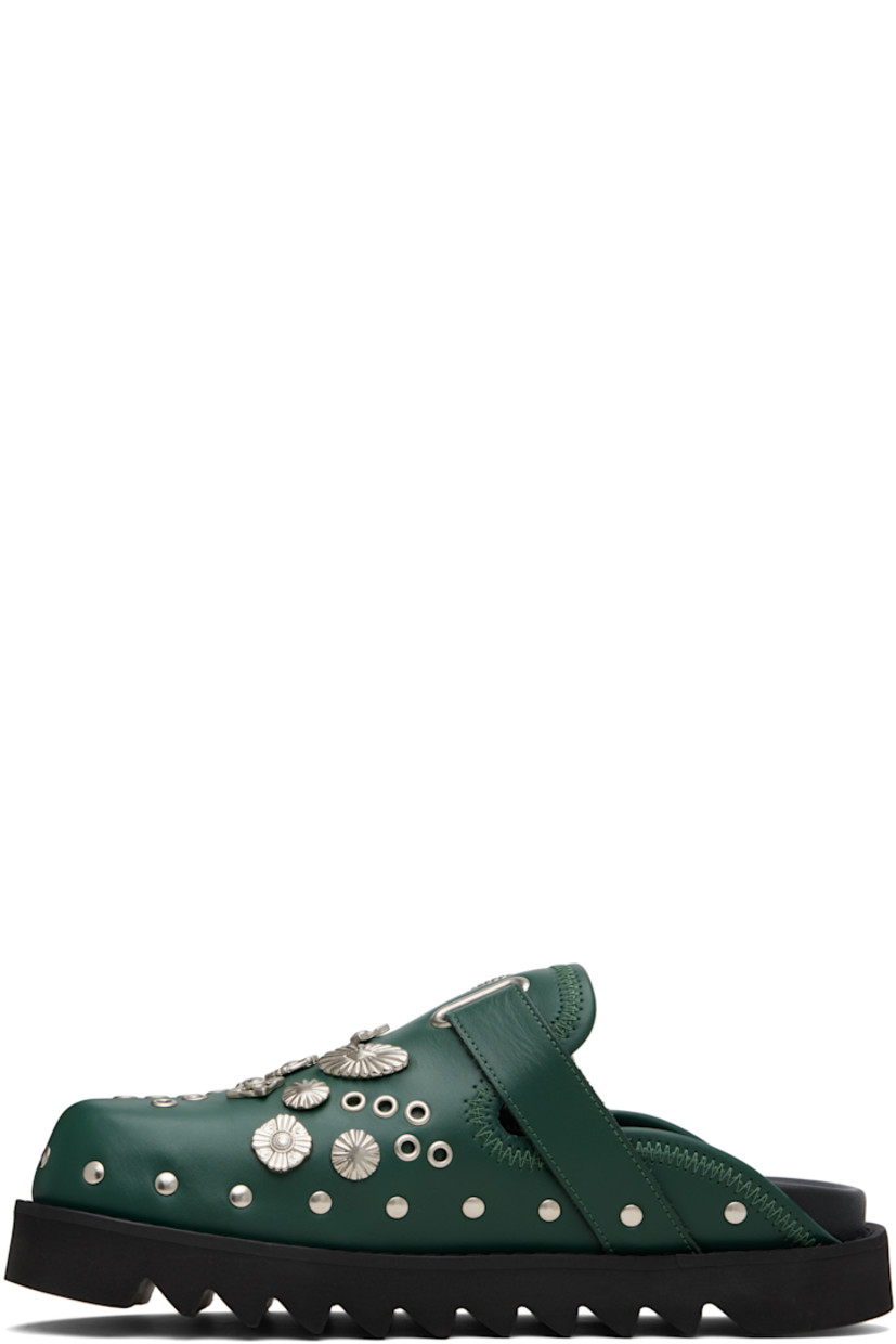 Buffed leather slip-on loafers.

· Studs at toe and sides
· Graphic hardware and metal eyelets at vamp
· Pin-buckle strap at vamp
· Mesh lining
· Foam rubber midsole
· Treaded rubber sole

Available exclusively at SSENSE.

Supplier color: Dark green leather