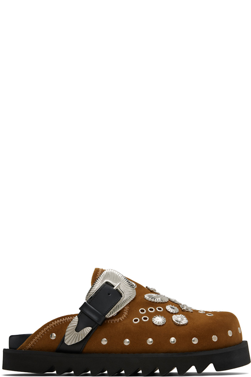 Suede slip-on loafers.

· Studs at toe and sides
· Graphic hardware and metal eyelets at vamp
· Pin-buckle strap at vamp
· Mesh lining
· Foam rubber midsole
· Treaded rubber sole

Available exclusively at SSENSE.

Supplier color: Khaki