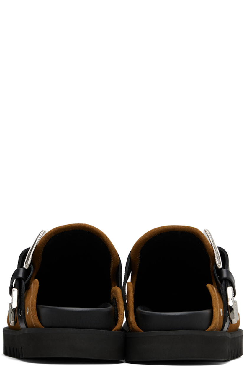Suede slip-on loafers.

· Studs at toe and sides
· Graphic hardware and metal eyelets at vamp
· Pin-buckle strap at vamp
· Mesh lining
· Foam rubber midsole
· Treaded rubber sole

Available exclusively at SSENSE.

Supplier color: Khaki