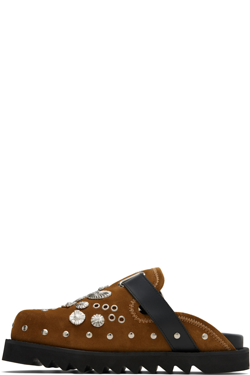 Suede slip-on loafers.

· Studs at toe and sides
· Graphic hardware and metal eyelets at vamp
· Pin-buckle strap at vamp
· Mesh lining
· Foam rubber midsole
· Treaded rubber sole

Available exclusively at SSENSE.

Supplier color: Khaki