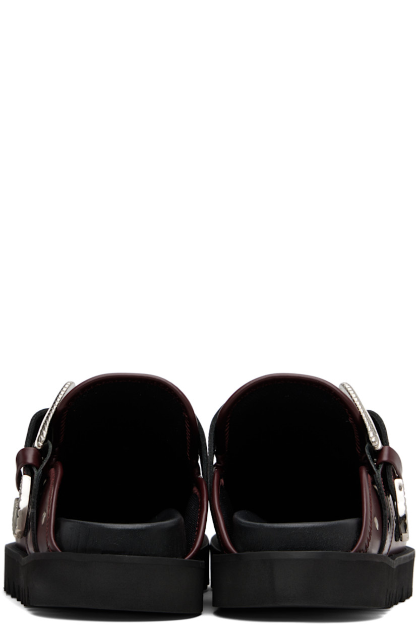 Buffed leather slip-on loafers.

· Studs at toe and sides
· Graphic hardware and metal eyelets at vamp
· Pin-buckle strap at vamp
· Mesh lining
· Foam rubber midsole
· Treaded rubber sole

Available exclusively at SSENSE.

Supplier color: Burgundy leather