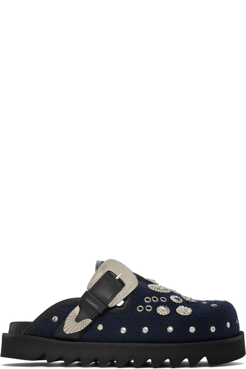 Melton slip-on loafers.

· Studs at toe and sides
· Graphic hardware and metal eyelets at vamp
· Pin-buckle strap at vamp
· Mesh lining
· Foam rubber midsole
· Treaded rubber sole

Available exclusively at SSENSE.

Supplier color: Black/Navy