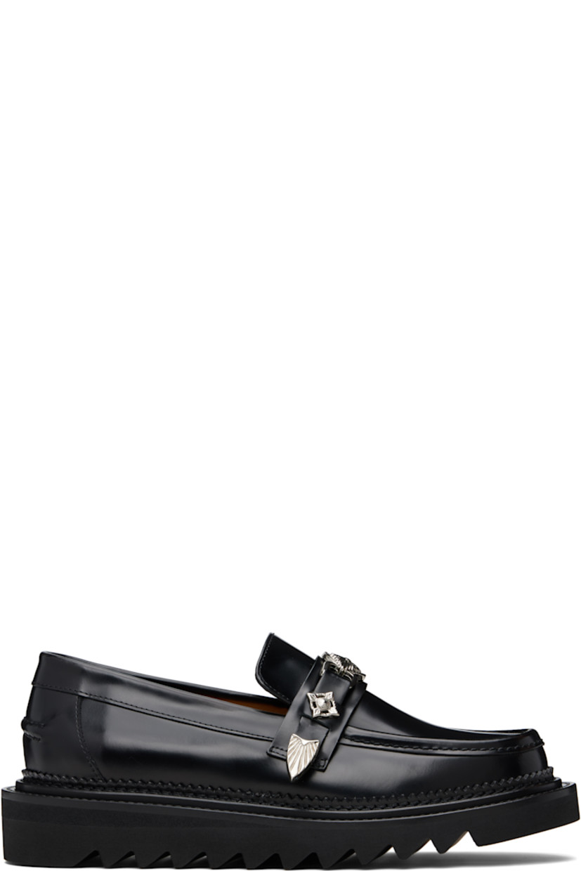 Buffed leather loafers.

· Moc toe
· Strap with graphic hardware at vamp
· Serrated detailing at welt
· Pinched seam at heel counter
· Foam rubber midsole
· Treaded rubber sole

Supplier color: Black