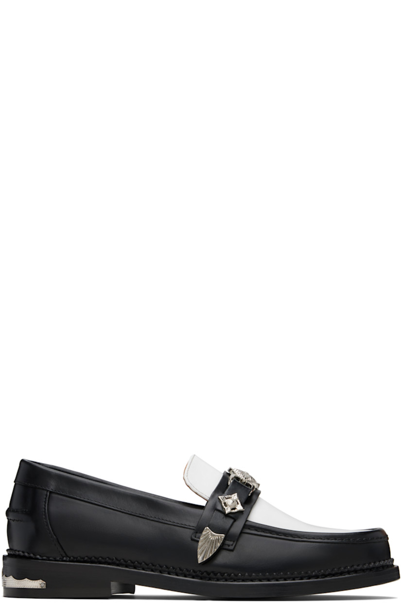 Polished leather loafers.

· Moc toe
· Strap with graphic hardware at vamp
· Pinched seam at heel counter
· Serrated edge at welt
· Buffed leather lining
· Engraved plaque at heel
· Stacked leather heel with rubber injection
· Leather sole

Available exclusively at SSENSE.

Supplier color: Black/White