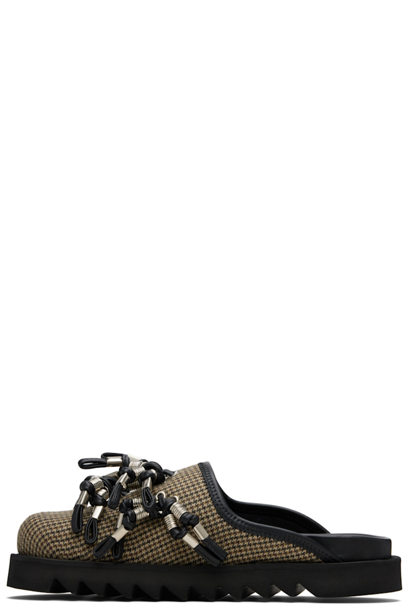 Flannel slip-on loafers.

· Prince of Wales pattern throughout
· Knotted straps with O-rings at vamp
· Mesh lining
· Foam rubber midsole
· Treaded rubber sole

Supplier color: Brown