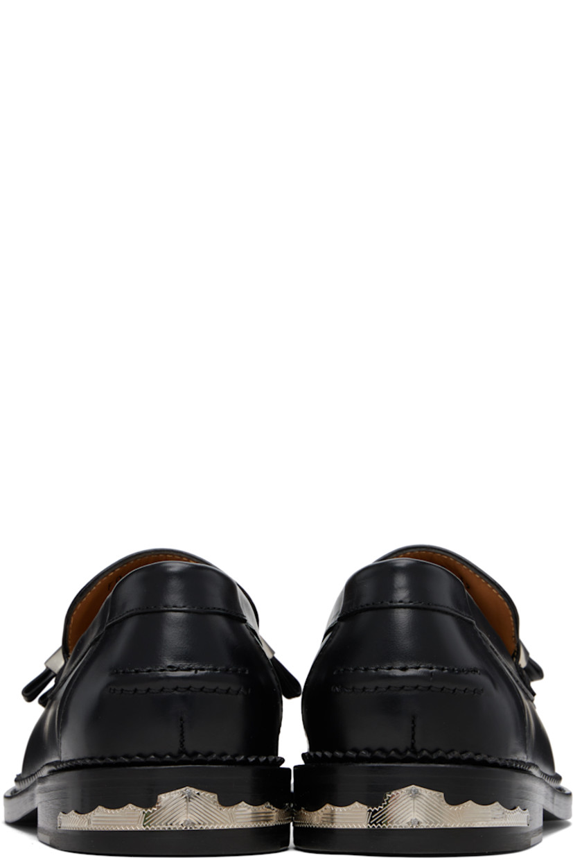 Buffed leather loafers.

· Moc toe
· Knotted strap with O-rings at vamp
· Pinched seam at heel counter
· Serrated edge at welt
· Engraved plaque at heel
· Stacked leather heel with rubber injection
· Leather sole

Supplier color: Black